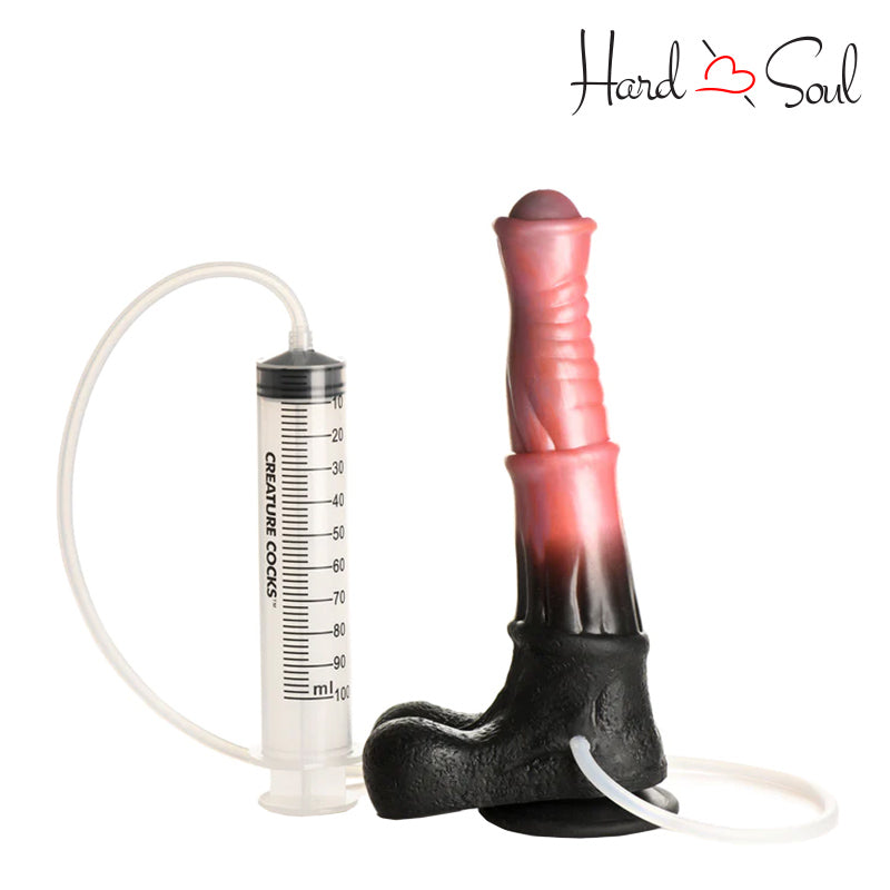 A white syringe and a Creature Cocks Centaur Explosion Squirting Dildo next to it - HardnSoul