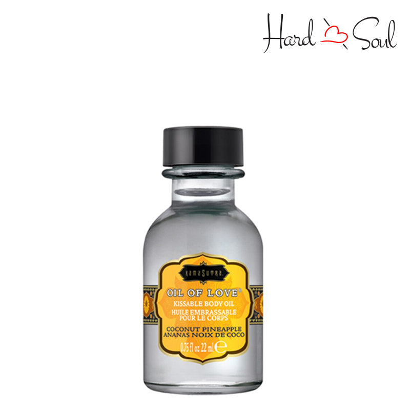 A 0.75 oz bottle of KAMA SUTRA Oil of Love Coconut Pineapple - HardnSoul