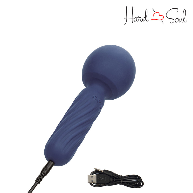 Charging cable next to Charisma Seduction Rechargeable Silicone Massager Wand Blue turned on to charging - HardnSoul