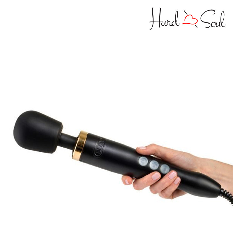 A Doxy Die Cast Wand Massager Black Gold in hand - HardnSoul