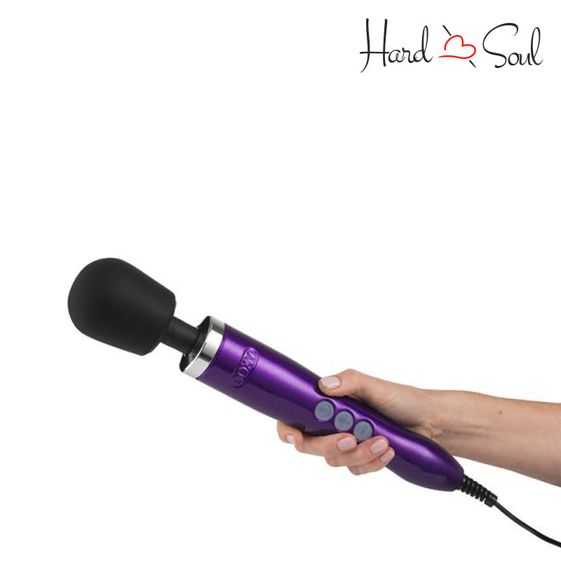 A Doxy Die Cast Wand Massager Purple in hand - HardnSoul