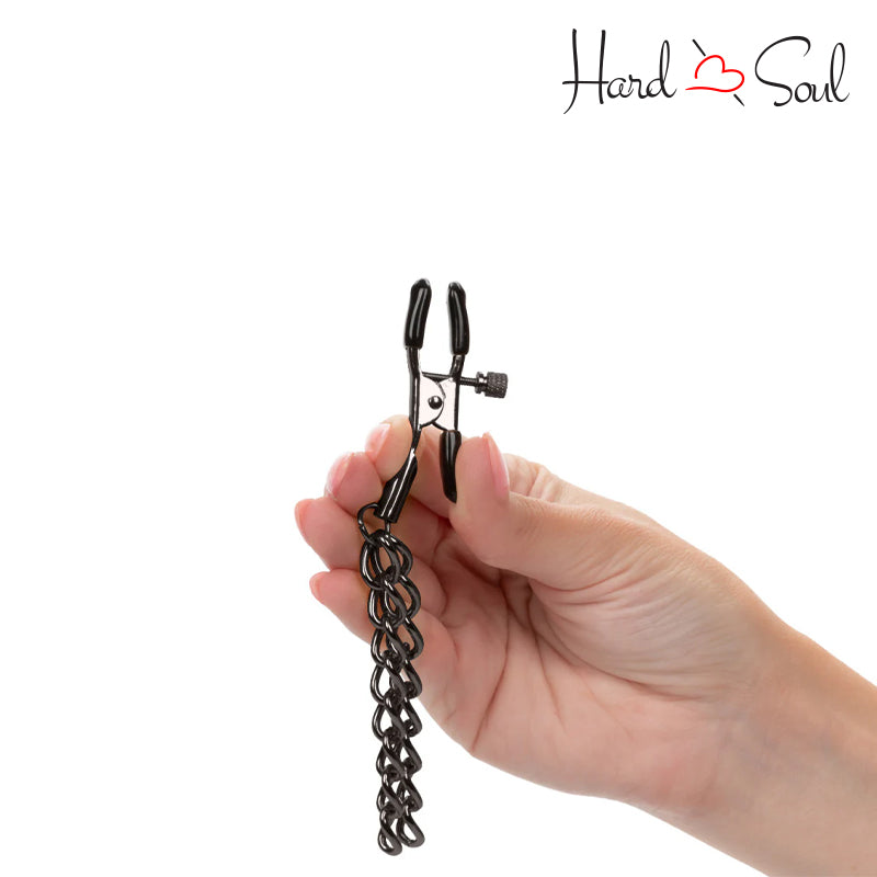 Black Euphoria Collection Chain Nipple Clamps in a Hand- HardnSoul