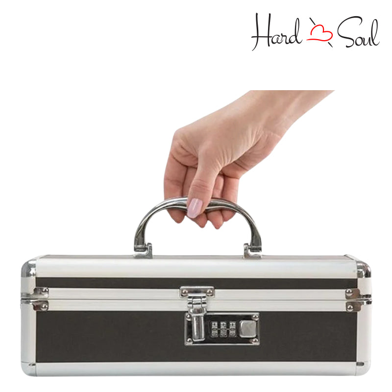 A Hand Holding  Medium Black Lockable Vibrator Case - HardnSoul