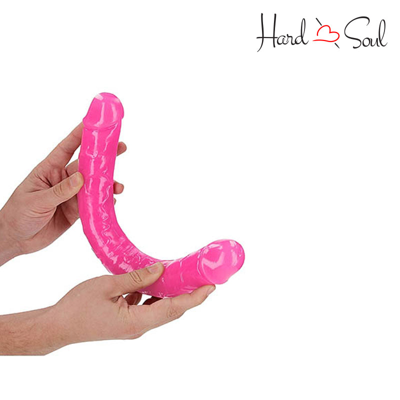 Tilted RealRock GITD 15 Inch Double Dildo Pink in a hand - HardnSoul