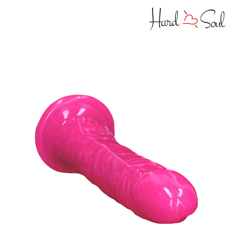 Top side of RealRock Glow in the Dark 7 Inch Slim Dildo Pink - HardnSoul