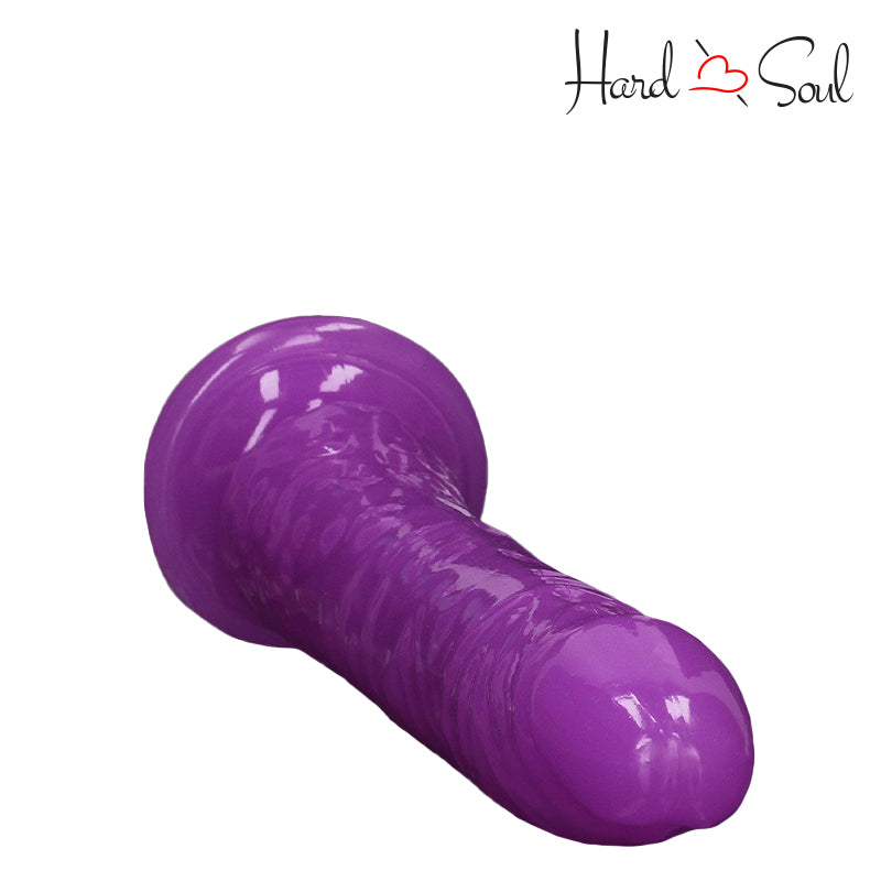 Top side of RealRock Glow in the Dark 8 Inch Slim Dildo Purple - HardnSoul