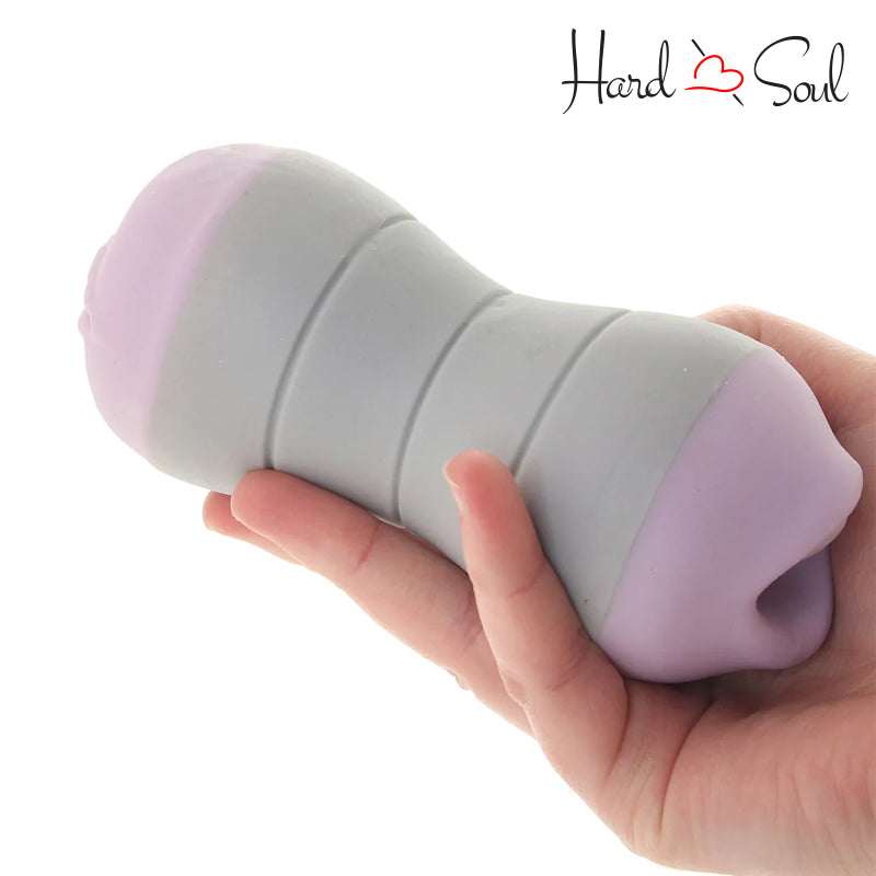 A Hand holding Travel Gripper Stroker Pussy & Mouth - HardnSoul